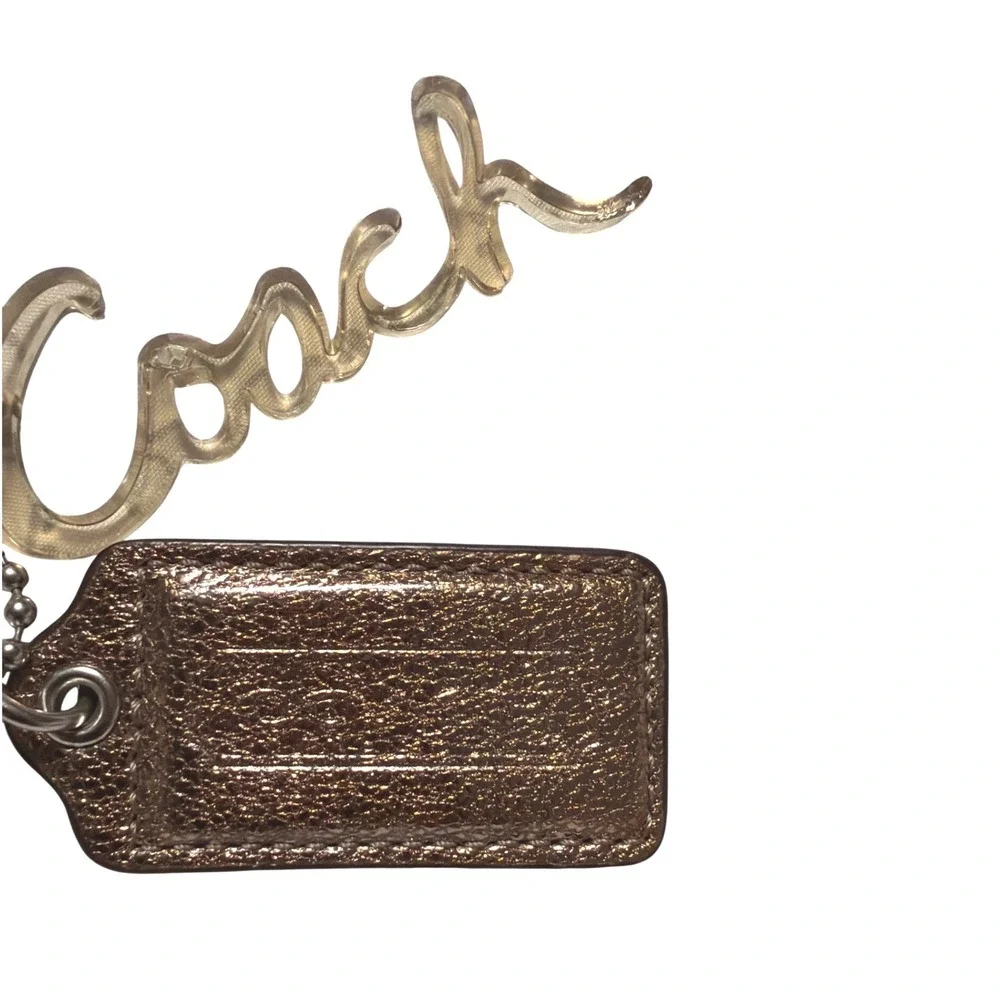 Coach Metallic Bronze Leather Hangtag and Clear Acrylic Script Logo Bag Charm